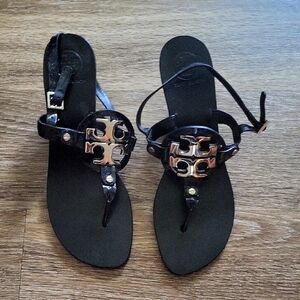Tory Burch Black and Gold Sandals with Sleek Design